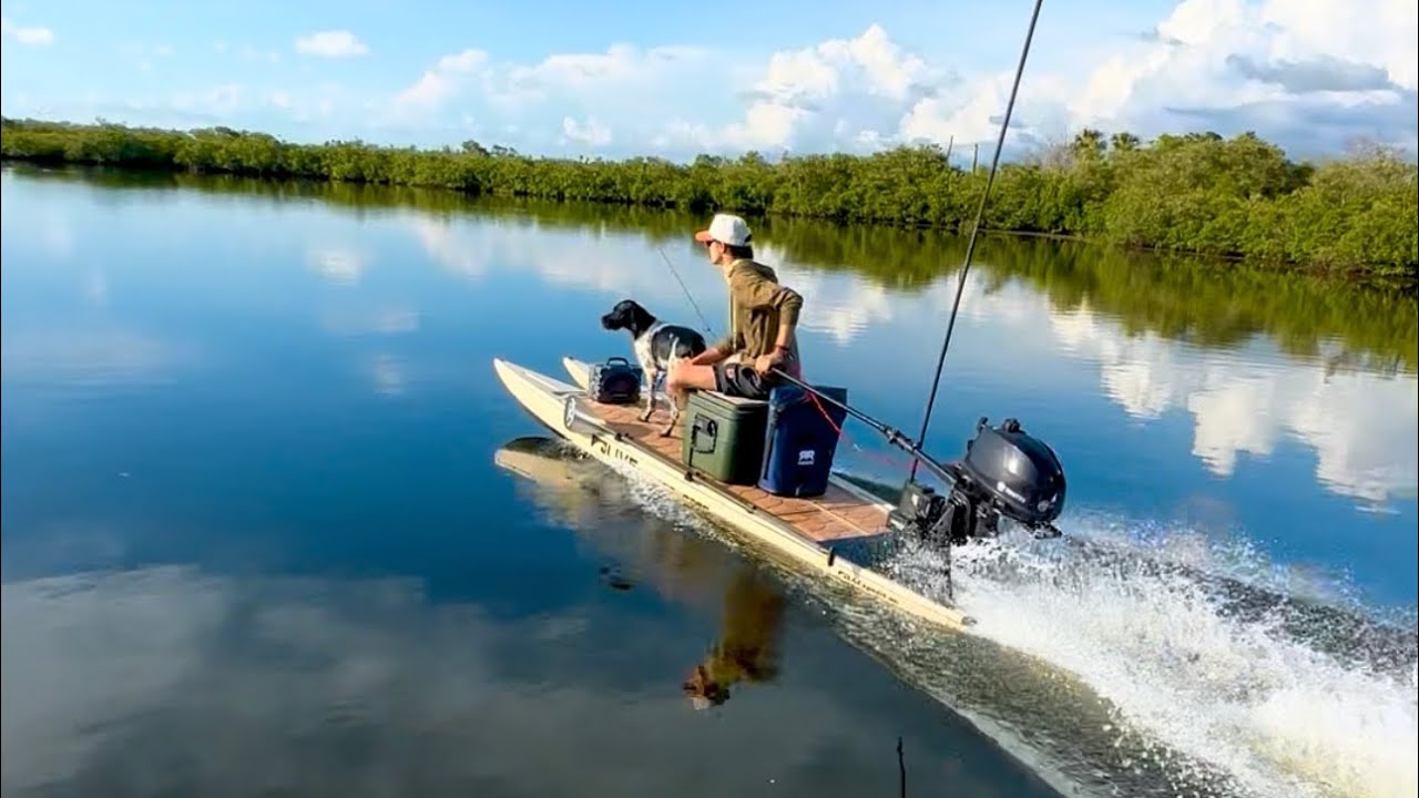 A SUP Customs hybrid skiff running skinny water